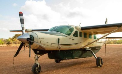 Light safari aircraft on a bush airstrip, used for one day fly-in safaris from Zanzibar to Nyerere and Mikumi